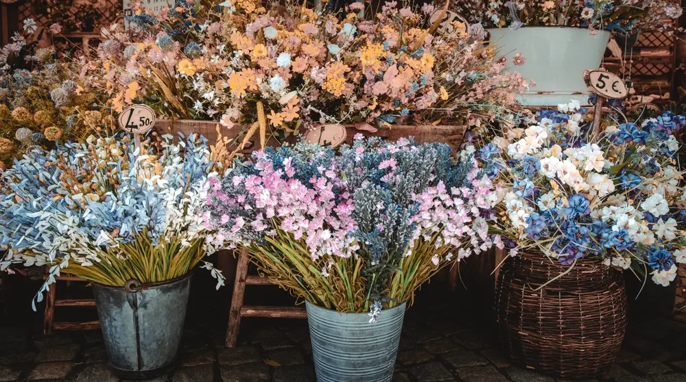 Colorful flowers in vases and pots showcasing a lifelong floral business tradition
