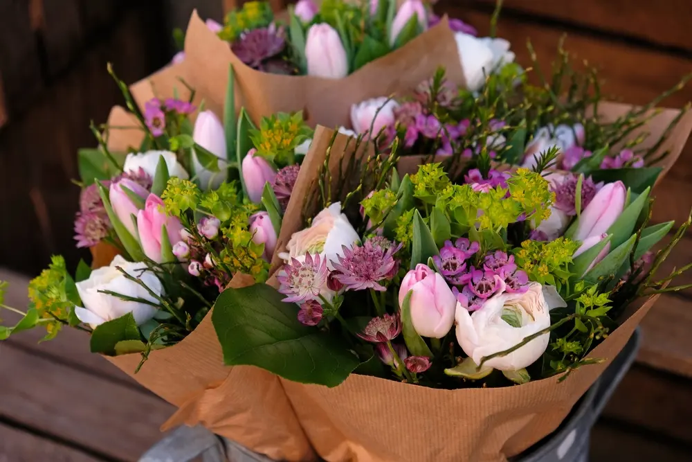 Three wrapped bouquets of fresh pink and white flowers ready for delivery in Brentwood, PA