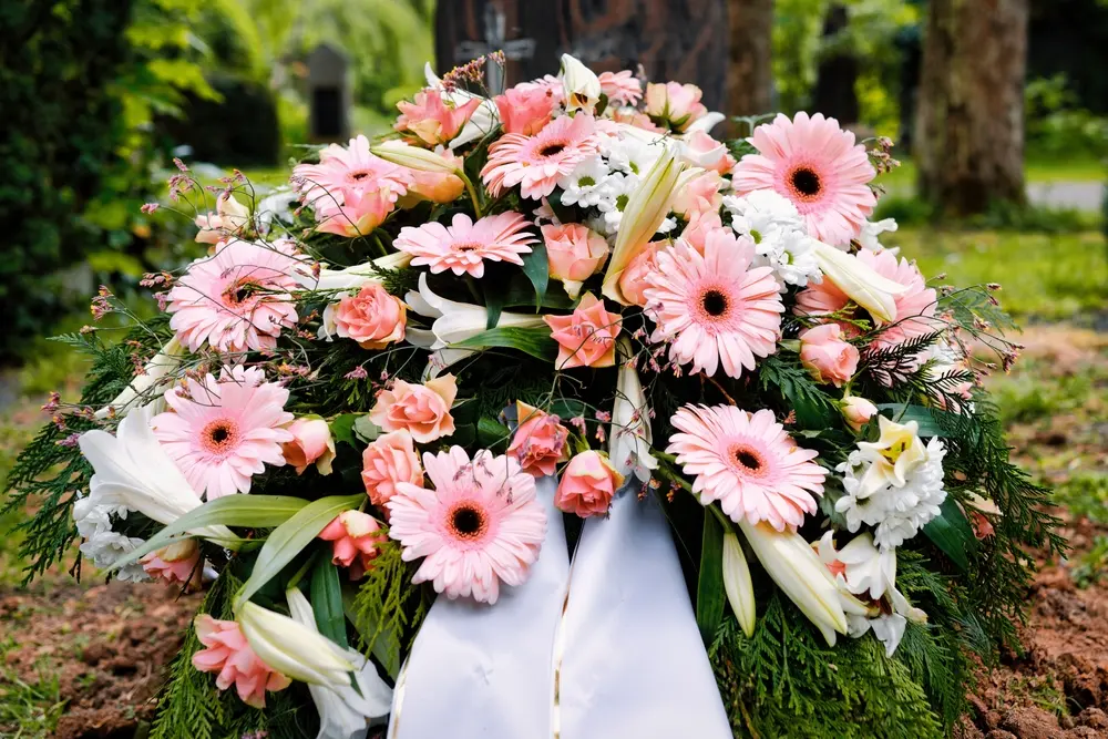 Pink flowers tied with a white ribbon for Brentwood floral services