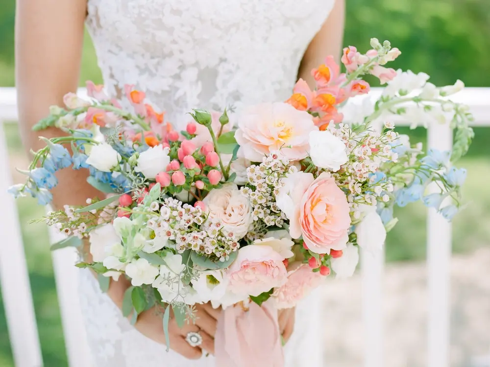 Bride holding a colorful bouquet for wedding flowers in Brentwood, PA